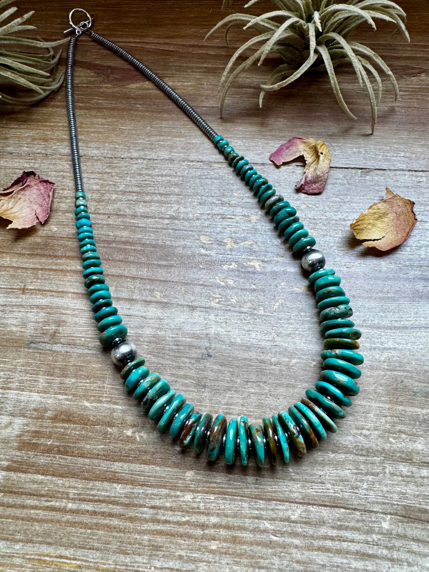 22 inch Graduated Green necklace with Sterling silver pearls