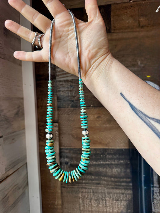 22 inch Graduated Green necklace with Sterling silver pearls