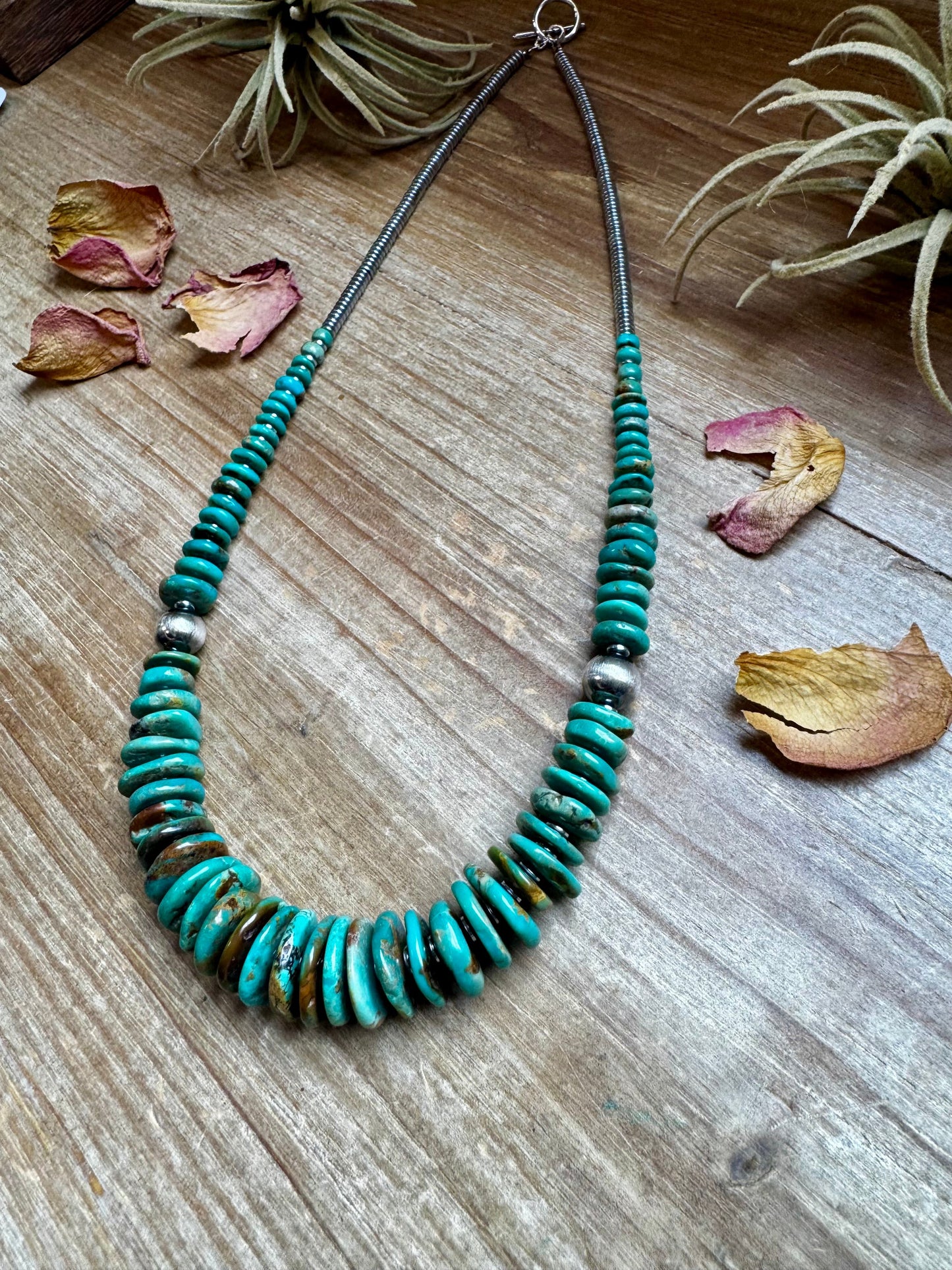 22 inch Graduated Green necklace with Sterling silver pearls