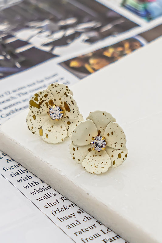 Metal flower earrings with rhinestone center