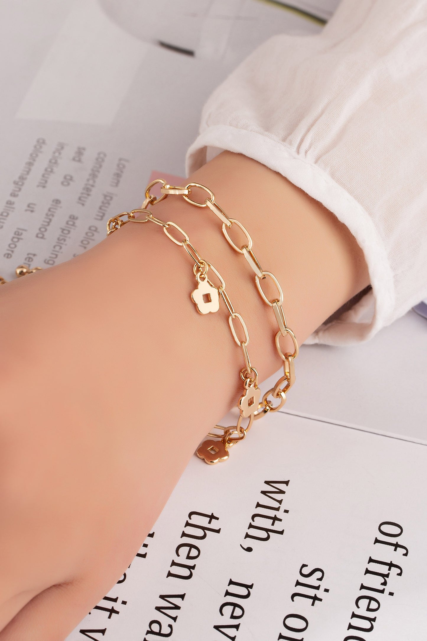 Two brass bracelet set with flower charms