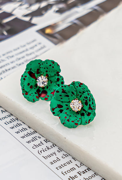 Metal flower earrings with rhinestone center
